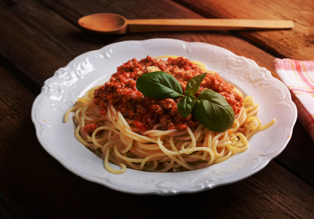 Tasty spaghetti with cheese and basilの写真素材