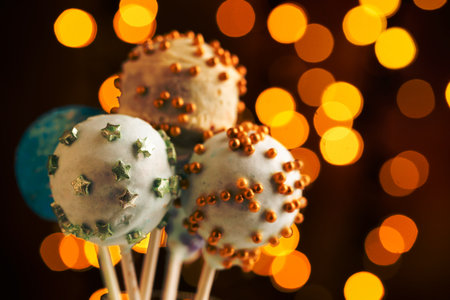 Colorful cake pops on the blurred bokeh backgroundの写真素材