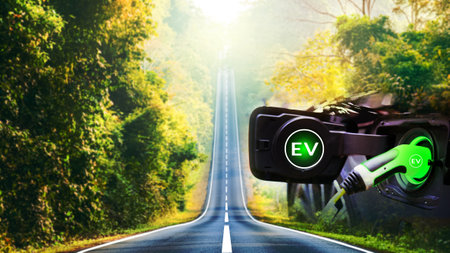 Charge EV electric car hybrid technology. Drive clean energy on nature travel with icon illustration EV electronic vehicle blur background future green eco car environment friendly power conceptの写真素材