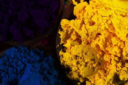Colorful, finely powdered Indian pigments. Closeup on yellow.の写真素材