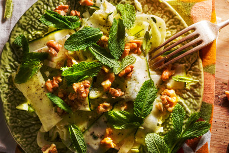 Healthy eating: raw fennel salad with walnuts, raw courgettes, mint leaves and lemon juice. Zesty, fresh, summery and light food. Perfect for a diet.の写真素材