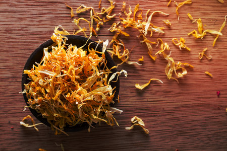 Closeup on dried marigold petals: for tea, alternative medicine, pot-pourri. Copy space.の写真素材