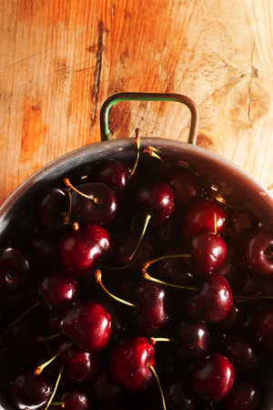 Ripe cherries on rustic wooden backgroundの写真素材