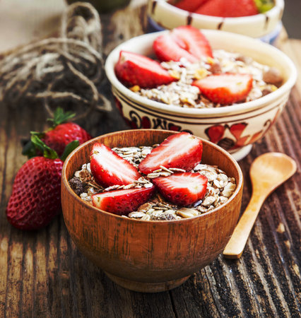 Healthy Breakfast with Muesli and Strawberry Fruits in a Bowlの写真素材
