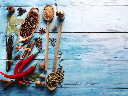 Different spices on old wooden table.の写真素材