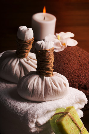 SPA still life: massage equipment, towels,pebbles and herbsの写真素材