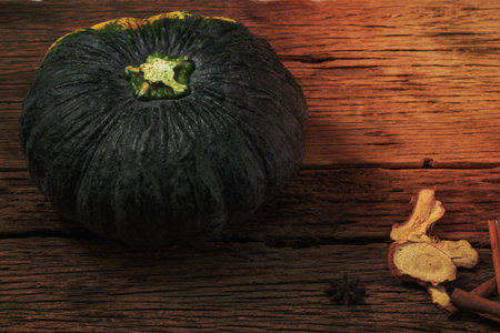 Pumpkin spice cinnamon on wood background, top view, healthy food concept.の写真素材