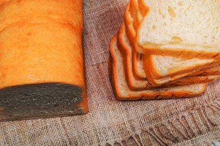 loaf bread slice isolated on white background close up, top view, food and drink concept.