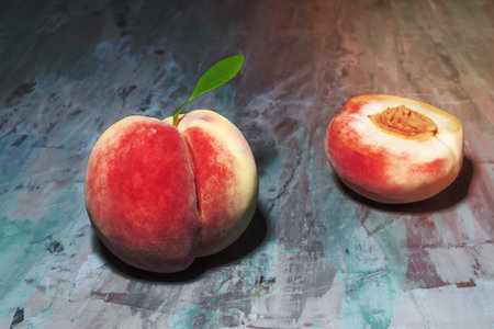 Peach fruit isolated on blue wood background top view close up, healthy food concept.の写真素材