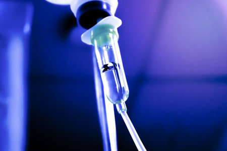 saline drop with blur background. Illness treatment. Health insurance plan. Medical Benefits.の写真素材