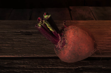 Whole beetroot isolated on wood background, healthy food concept.の写真素材