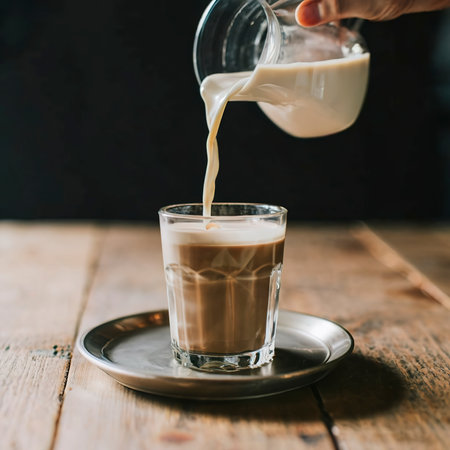 glass of coffee with milk on the tableの素材
