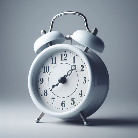White retro alarm clock isolated on gray background with copy spaceの素材