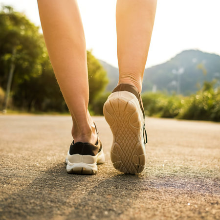 Close up of woman strecthing feet with shoe with nature backgroundの素材