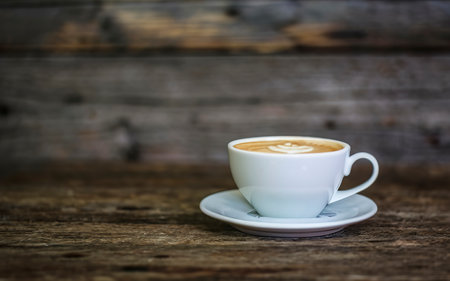 Cup of coffee on a wooden tableの素材