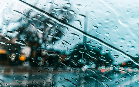 Heavy rain background, Raindrops on window glass outdoorsの素材