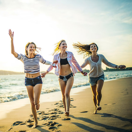 Young women having fun at the beachの素材