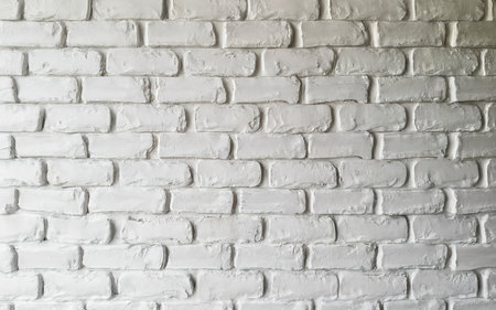 White brick wall texture background. Brickwork or stonework flooring interior designの素材