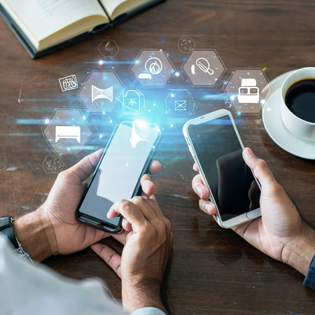 Hands and phones, online communication Online business Concept of using technologyの素材