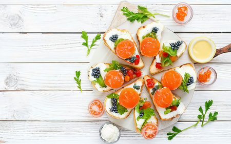 Canape with salmon red caviar. Sandwich for lunch. Delicious foodの素材