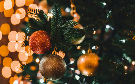 Christmas decoration balls on abstract bokeh black background with copy space and decorative LED lightsの素材