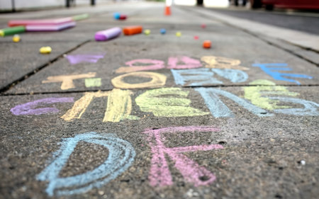 colorful chalk on a street in the summerの素材
