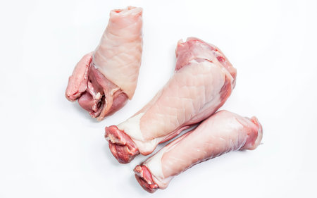 Raw pork hoof, feet, trotters Isolated on white backgroundの素材