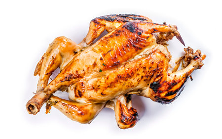 Butchered grilled whole chicken. Isolated on white backgroundの素材