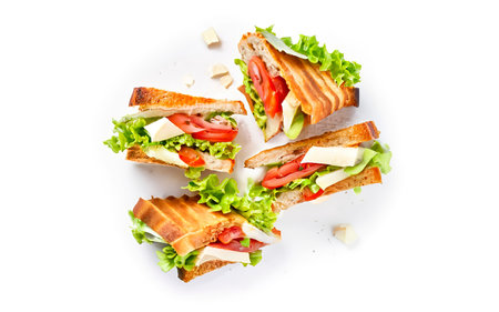 Toasted Club sandwiches with pork ham, cheese, tomatoes and lettuce Isolated on white backgroundの素材