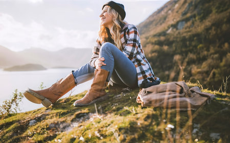 Wanderlust concept with young woman enjoying the peace around herの素材