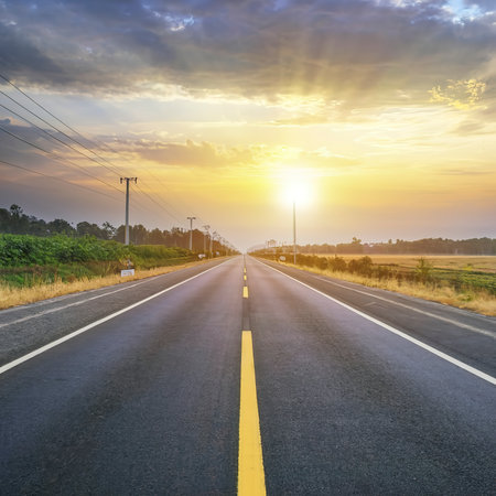 highway road , transportation roadtrip concept. on asphalt expressway with sunrise skyの素材