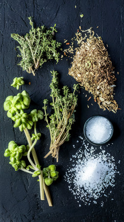 Fresh organic Oregano and Thyme decorated with dry thyme and oregano, thyme vinegar and saltの素材