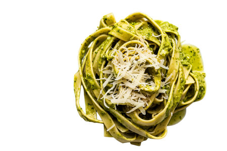 tagliatelle pasta coated in a vibrant green pesto sauceの写真素材