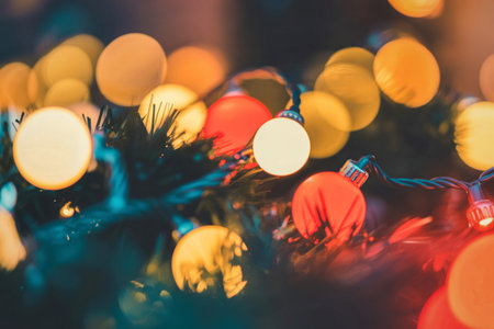 Abstract background with out of focus circular lights in warm tones creating a dreamy and festive atmosphere.の写真素材