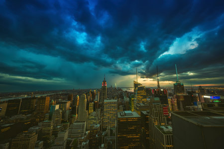 A dramatic view of a city skyline illuminated by the ethereal glow dancing across the night sky.の写真素材