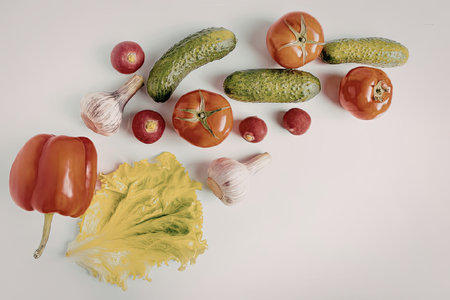 Fresh vegetable arrangement on white background