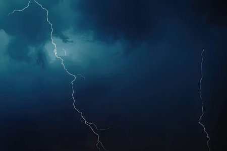 a dark blue sky with lightning bolts illuminating the clouds