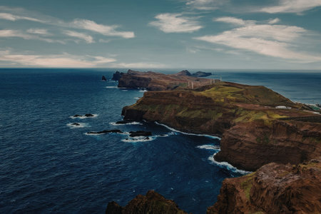 Majestic ocean cliffs under blue sky