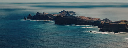 The image depicts a serene ocean landscape with rocky islands and waves crashing against the shore,...