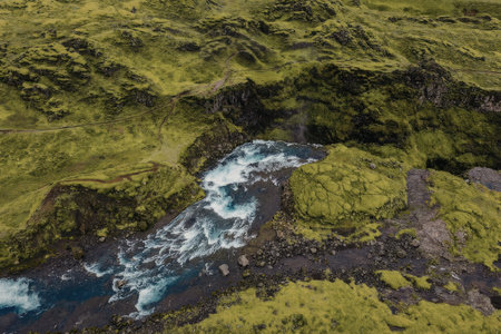 Majestic waterfall cascading down rocky terrain