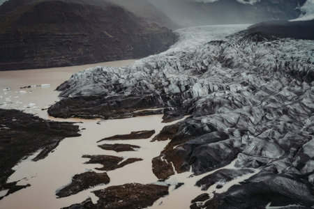 Melting glacier landscape with rocky terrainの写真素材