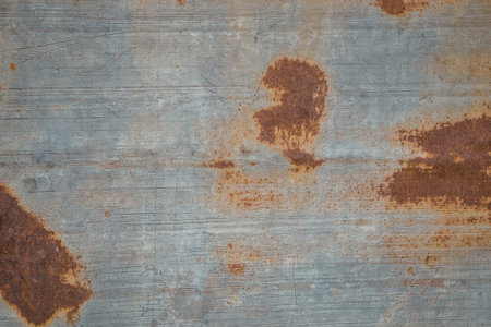 A close-up view of a rusty metal surface with visible signs of oxidation and decay.