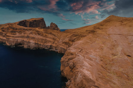 Majestic rocky cliffside overlooking serene waters