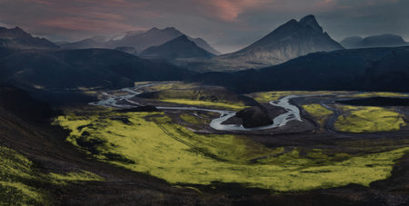 a serene mountain landscape with a winding river flowing through a lush green valley surrounded by...