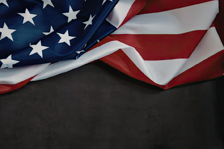 Unfurling american flag on dark background