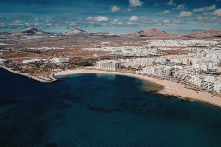 Scenic aerial view of coastal town with mountains