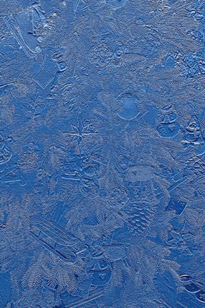 A close-up view of a blue textured surface with a rough, uneven pattern.