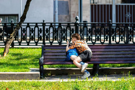 a couple sitting on a park bench