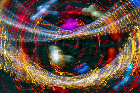 Abstract image of colorful light trails in motion, creating a dynamic and blurry effect.