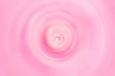 A pink swirl pattern background with a white stripe at the bottom